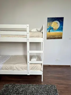 a room with two bunk beds and a painting at Dukes View -explore Haspengouw & surrounding towns in Zoutleeuw