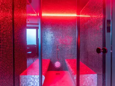 a red bathroom with a tub and a toilet at Temple Torii in Crisnée