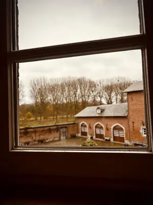 a view from a window of a brick building at 'T Rood Kasteel in Hasselt