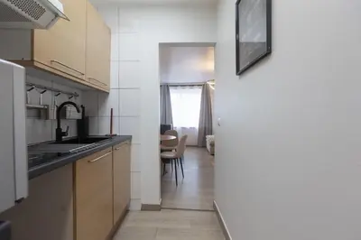 a kitchen with a sink and a counter top at Moni 2D Residence in Seraing