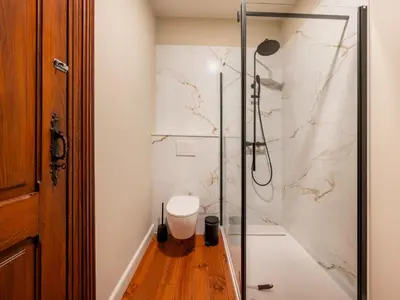a bathroom with a shower with a toilet in it at Picturesque mansion with garden in Tongeren in Tongeren