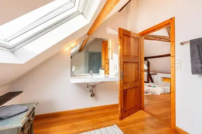 a bathroom with a sink and a mirror at Zum Alten Kuhstall - Südgarten & Terrasse - Großes Landhaus mit Sauna in Lontzen