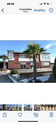 a picture of a building with a palm tree at Villa a Chaudfontaine in Chaudfontaine