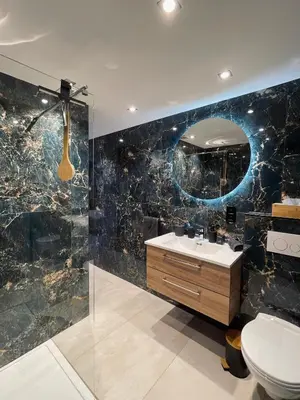 a bathroom with a sink and a mirror at Charnel - Bora Bora in Liège