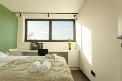 a bedroom with a bed with towels on it at 8P 4B Luxury Villa Close to Maastricht in Lanaken