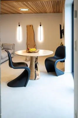 a dining room with a table and two chairs at Le Marzelheide 3 in Lontzen
