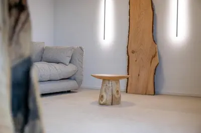 a living room with a table and a couch at Le Marzelheide 3 in Lontzen