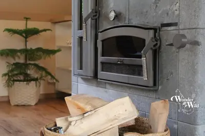 a toaster oven on a wall next to a plant at Wonderwild E87, Connect to nature & Dog Friendly in Lanaken