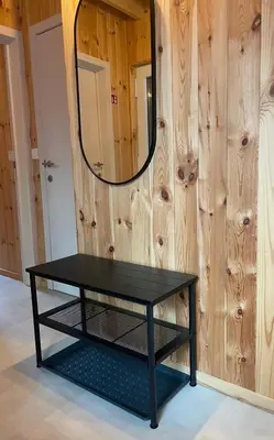 a black table in a room with a mirror at Lysdann Zutendaal in Zutendaal