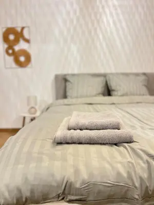 two towels are stacked on top of a bed at Casa Cielo-Spectacular View-Center-Chic-Spacious in Liège