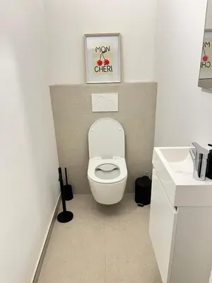 a bathroom with a toilet and a picture on the wall at Casa Cielo-Spectacular View-Center-Chic-Spacious in Liège