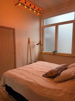 a bedroom with a bed and a window at Appartement Premium à Liège in Liège