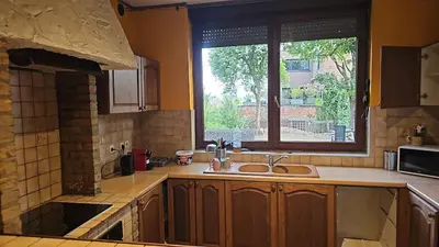 a kitchen with a sink and a window at Charlemagne house in Liège