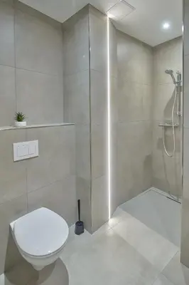 a bathroom with a toilet and a shower at Riverside Holiday in Eupen