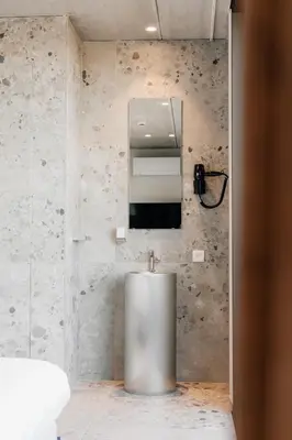 a bathroom with a silver sink and a mirror at Coliving - Bord de Meuse - L'atelier de la Meuse in Oupeye