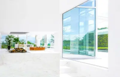 a living room with a large glass window at Villa Bianca in Dalhem