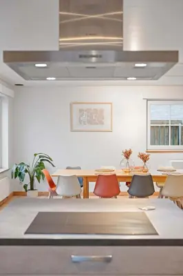 a dining room with a table and chairs at Ruime vakantievilla in Halen voor 12 personen in Halen