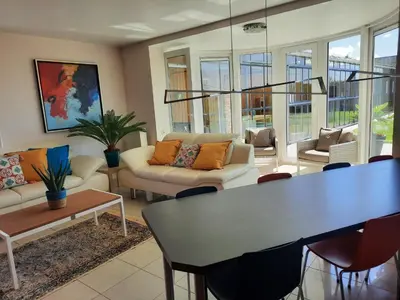 a living room with a couch and a table at Holiday Home Mooi - Voeren in Voeren