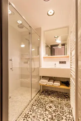 a bathroom with a shower and a glass shower stall at De Sjeiven Dorpel in Maaseik