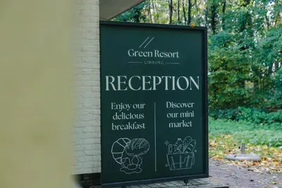 a sign for a green resort with drawings on it at Green Resort Limburg in Houthalen-Helchteren