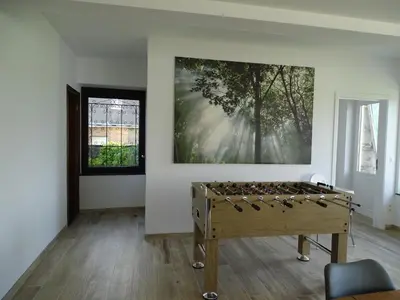 a room with a large painting on the wall at La Balade d'Annie in Trooz