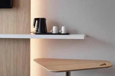 a shelf with a coffee maker on it at Holiday Inn Express Hasselt by IHG in Hasselt