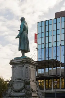 a statue of a woman in front of a building at ibis Liège Centre Opéra in Liège