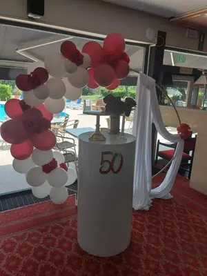 a table with a bunch of red and white balloons at Globales Post Hotel & Wellness in Herstal