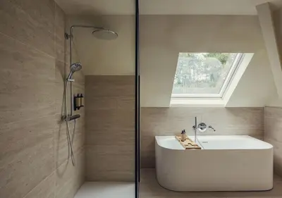 a bathroom with a white sink and a shower at Stiemerheide - The Urban Hotel & Golf Retreat 4 Star Superior in Genk