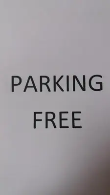 a sign with the words parking free written on it at Premiere Classe Liege / Luik in Liège