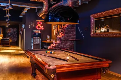 a room with a pool table in a bar at pentahotel Liège in Liège