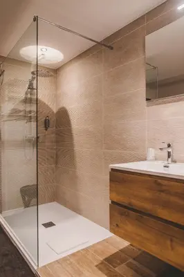 a bathroom with a sink and a shower at Hôtel Hors-Château - Liège Centre Historique in Liège