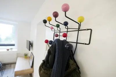 a vase with a plant with colorful balls on it at Xperience-Today Eupen in Eupen
