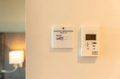 a lightswitch on a wall in a room at Mezzo Hotel & Business in Beringen