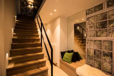 a staircase in a house with a green pillow at Wellness Hasselt B&B in Hasselt