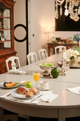 a table with plates of food and drinks on it at Faubourg Saint Martin in Liège