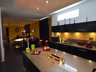 a kitchen with a counter with some drinks on it at Holiday Home in Welkenraedt with Sauna in Welkenraedt
