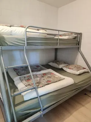 two bunk beds in a dorm room with at Den 1 Hengelhoef in Houthalen-Helchteren