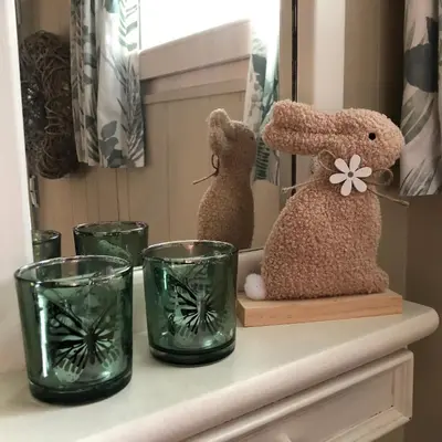 two stuffed rabbits sitting on a shelf with glasses at Chalet Relax in Zutendaal