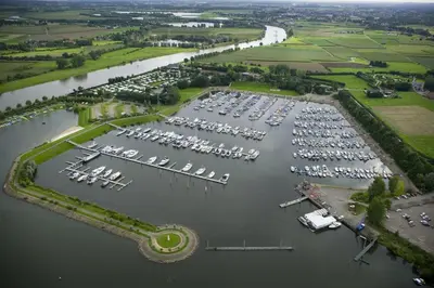 an aerial view of a marina with boats at Hotel De Spaenjerd in Kinrooi