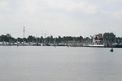 a view of a marina with boats in the water at Hotel De Spaenjerd in Kinrooi