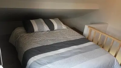 a bed in a small room with at 't Hagerhuys in Maaseik