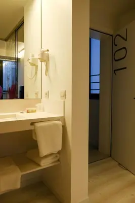 a bathroom with a sink and a mirror at Corbie Lommel Ring in Lommel