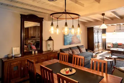 a living room with a table and a couch at De Villo in Hasselt