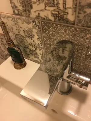 a bathroom with a sink with a toilet in it at fermette in Lontzen