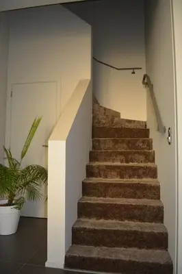 a staircase in a house with a stair case at Appartroom Hasselt in Hasselt
