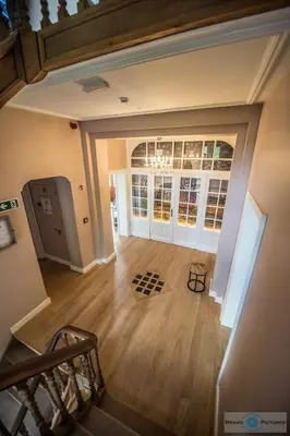an overhead view of a living room with a staircase at Villa Copis in Borgloon