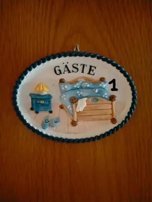 a plastic plate with a cake on a table at gasthof lederhose in Diepenbeek