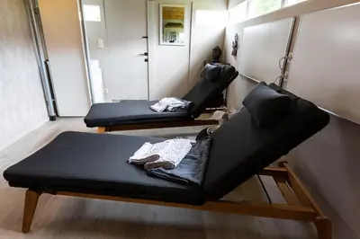 two black couches sitting in a room with at Bed 'n Blues **** in Halen