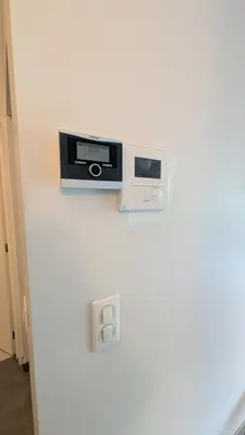 a wall with a tv on a white wall at Augustins in Liège
